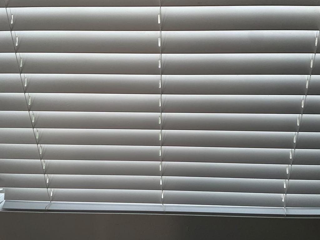 Blinds dusted by hand