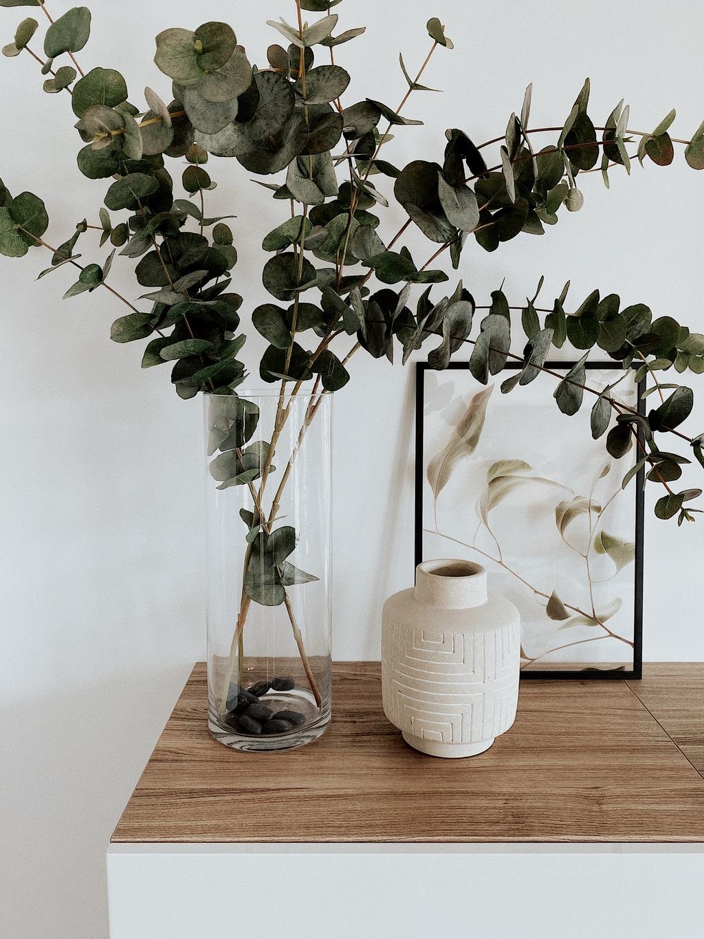 Dust-free console with a vase of eucalyptus